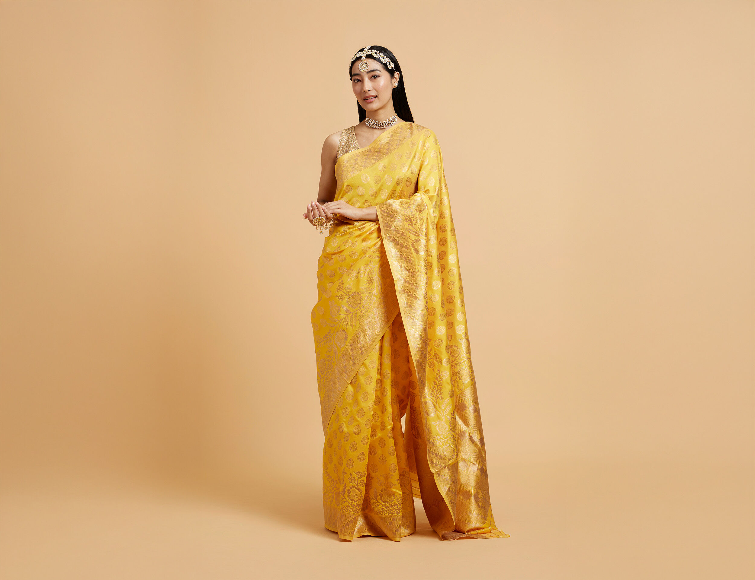 Bride flaunting her beautiful yellow saree for haldi ceremony